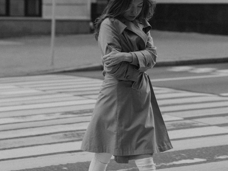 Person in a focused state of movement in a minimalist room.