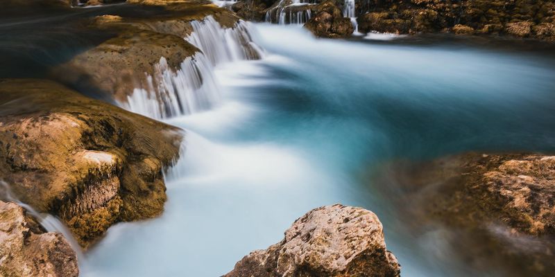 Silky smooth water flowing over rocks.